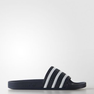 Experience comfort and style with the adidas adilette Slides Sandals, featuring a contoured footbed and iconic 3-Stripes design.