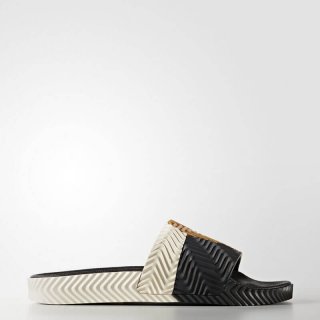 The adidas Originals by AW adilette Slide Black, the Ideal choice for SEC Championship Game fans looking for comfort and fashion.