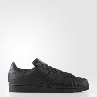 The adidas Superstar Shoes Black, showcasing a sleek monochromatic design and gridded leather upper, Ideal for those seeking a modern and sophisticated look.