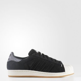 Level up your style with the adidas Superstar Skate Sneakers, featuring a touch of camouflage print and a durable waxed suede upper for a cool and edgy look.